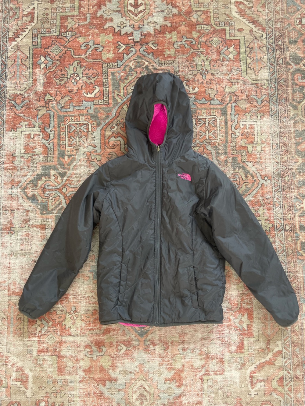 The North Face Kids' Black Puffer Jacket with Pink Lining Reversible